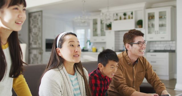 Happy Family Playing Video Games in Cozy Living Room - Download Free Stock Images Pikwizard.com