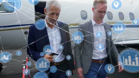 Business Team Walking From Private Jet With Digital Network Overlay