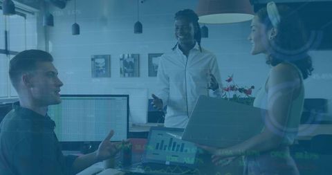 Diverse team engaging in data analysis in modern open-plan office