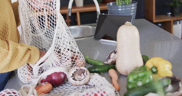 Person Unpacking Groceries on Kitchen Counter with Fresh Vegetables - Download Free Stock Images Pikwizard.com