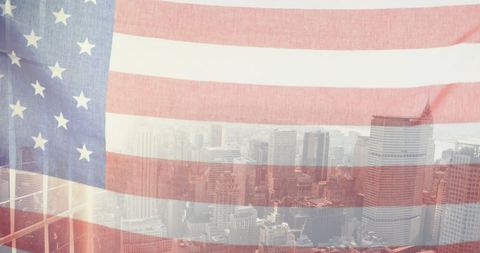 American flag overlapping busy city skyline at sunrise