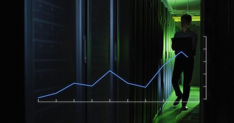 engineer analyzing server growth with overlay line graph - Download Free Stock Images Pikwizard.com