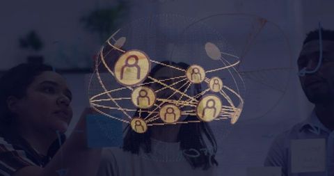 Team collaborating on glass board with augmented network hologram for strategy planning