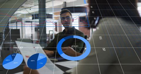 Diverse Team Analyzing Data with Dynamic Graphs in Modern Office - Download Free Stock Images Pikwizard.com