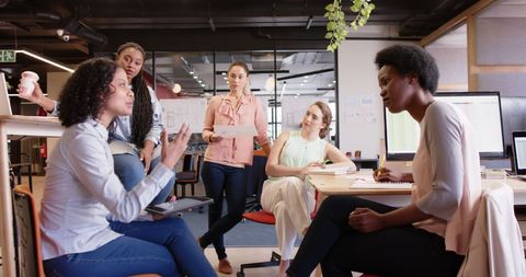 Diverse Businesswomen Collaborating in Modern Office Environment - Download Free Stock Images Pikwizard.com