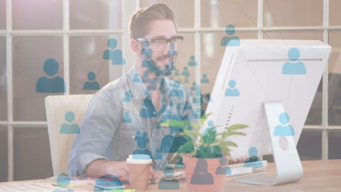 Businessman Integrating Data on Computer with Network Icons