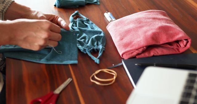 Person Sewing Protective Face Masks at Home Using Cloth and Tools - Download Free Stock Images Pikwizard.com