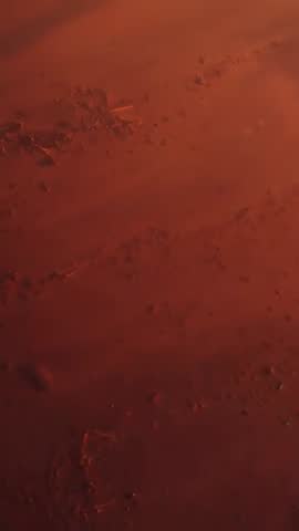 Vertical Aerial Drone Drifting Over Red-Brown Rocky Terrain Revealing Pebbles and Cracks