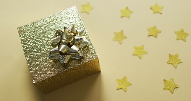 Gold Gift Box with Shiny Bow and Star Decorations - Download Free Stock Photos Pikwizard.com