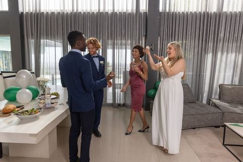 Joyful Bridal Party Celebrating in Modern Lounge