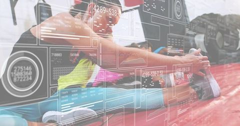 Woman stretching on mat with futuristic data hud overlay during group fitness training