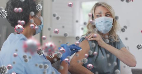 Healthcare professional administering covid-19 vaccination to patient