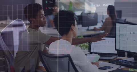 Diverse Women Discussing Data in Modern Office Environment