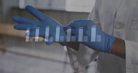 Healthcare Professional Wearing Gloves with Analytical Chart Overlay