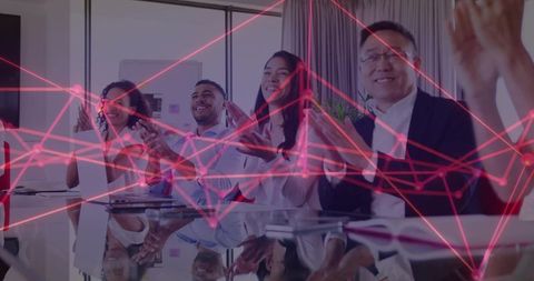 Team clapping in conference with digital network technology overlay