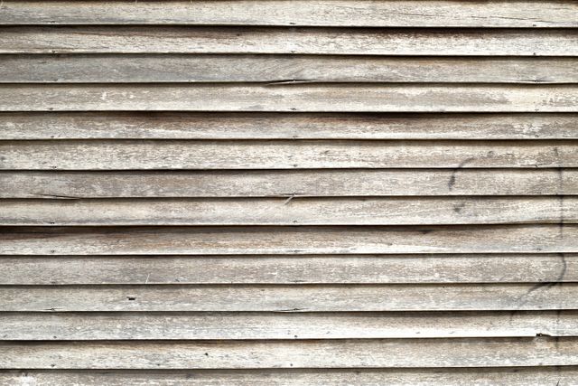 Detailed close-up of old wooden planks with a weathered texture. This image is perfect for use in design projects that require a rustic or vintage background. Suitable for website headers, product presentations, and print materials to convey a natural or rustic theme.