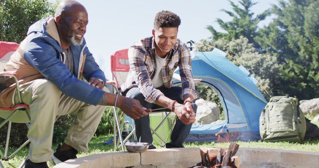 Father and Son Bonding While Toasting Marshmallows - Download Free Stock Images Pikwizard.com