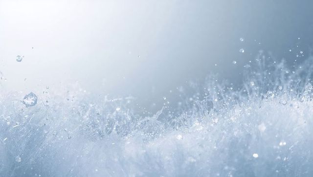 Sparkling micro-splashes creating crystal frost macro with soft gradient bokeh