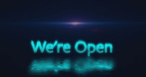 Illuminated neon sign with teal glow reflecting on floor in ambient mood