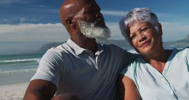 Elderly Couple Relaxing on Beach with Scenic Ocean View - Download Free Stock Images Pikwizard.com