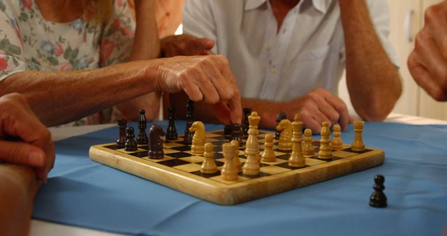 Mid section of senior friends playing chess at home 4K - Download Free Stock Photos Pikwizard.com
