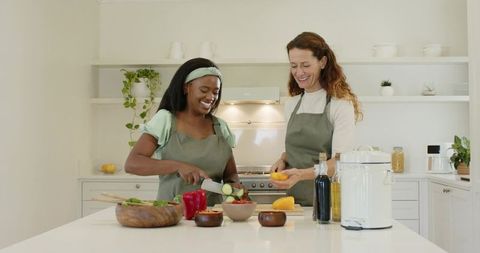 Diverse Friends Cooking Together in Modern Kitchen Interior