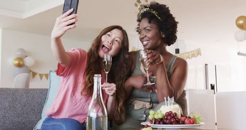 Joyful Biracial Couple Enjoying Birthday Celebration with Selfie