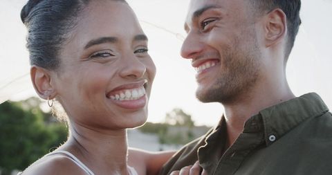 Smiling Biracial Couple Enjoying Time Outdoors