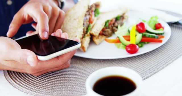 Person Using Smartphone While Having Lunch - Download Free Stock Images Pikwizard.com