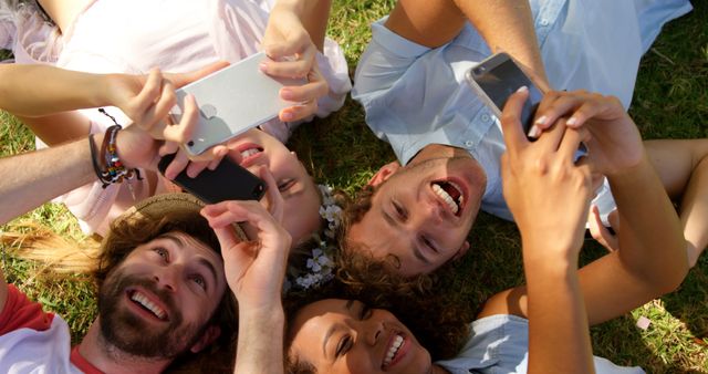 Friends Lying in Circle Enjoying Mobile Devices - Download Free Stock Images Pikwizard.com