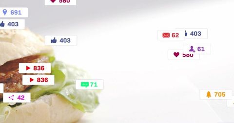 Close-up burger with floating social media notifications showing digital food engagement