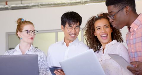Diverse Team Collaborating with Technology in a Modern Office - Download Free Stock Images Pikwizard.com