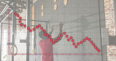 Athlete reaching for gym rings while data graph tracks training progress and performance