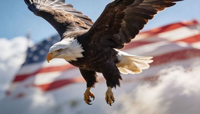 Majestic bald eagle soaring with talons extended over american flag, iconic freedom symbol