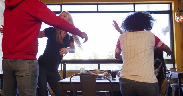 Friends Welcoming Each Other with Hugs in Cozy Café - Download Free Stock Images Pikwizard.com