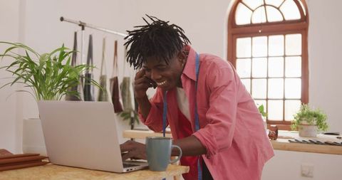 African American Craftsman Enthusiastically Making Business Call