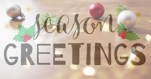 Season's Greetings Over Christmas Decorations on Wooden Background