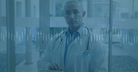 Doctor Analyzing Medical Data on Tablet in Hospital Setting