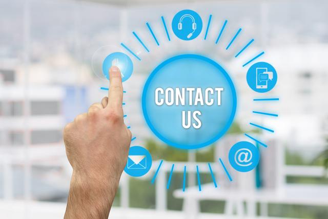 Hand pointing at contact us icons on a virtual screen, ideal for business websites, customer service pages, and tech support advertisements. Emphasizes ease of contact and modern communication methods.
