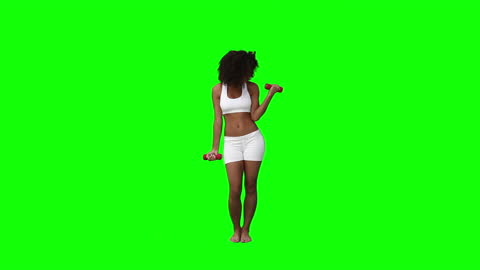 Woman Exercising with Dumbbells on Studio Green Screen
