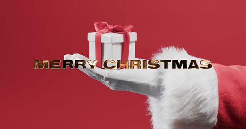 Santa Claus Hand Holding Gift with Merry Christmas Text