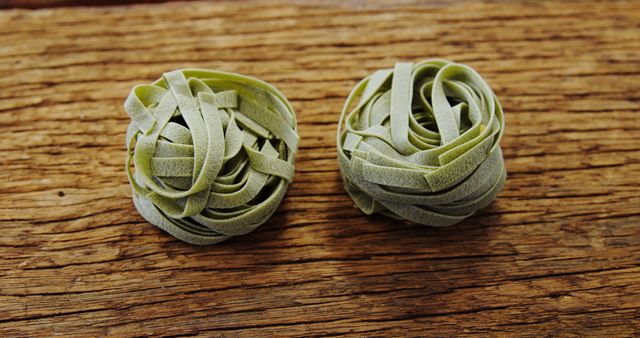 Close-up of Green Pasta Nest on Rustic Wooden Surface - Download Free Stock Images Pikwizard.com