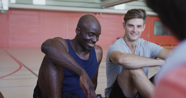 Two Athletes Smiling and Chatting During Sports Practice Break - Download Free Stock Images Pikwizard.com