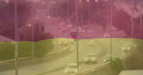 Urban highway with vehicles during rainy evening