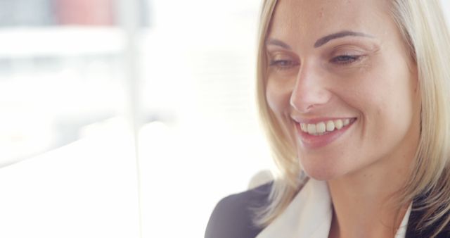 Smiling Businesswoman with Blond Hair in Professional Attire - Download Free Stock Images Pikwizard.com