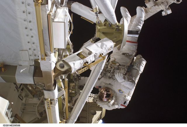 Astronaut pictured performing a spacewalk during construction of the International Space Station (ISS). Ideal for articles on space exploration, scientific missions, NASA operations, or human achievements in space technology.