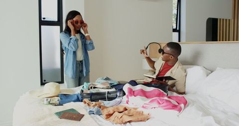 Couple Packing Suitcase for Vacation Adventure Together