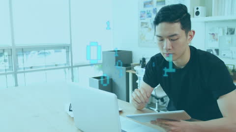 Tech-Savvy Businessman Analyzing Data on Tablet