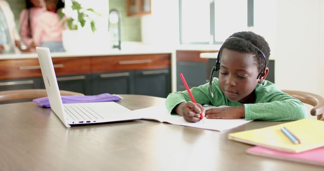 Focused Child Doing Online Schoolwork at Home - Download Free Stock Images Pikwizard.com