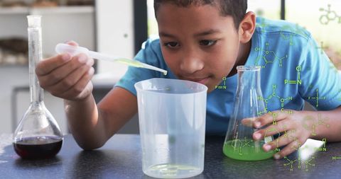 Curious child conducting chemistry experiment with beakers